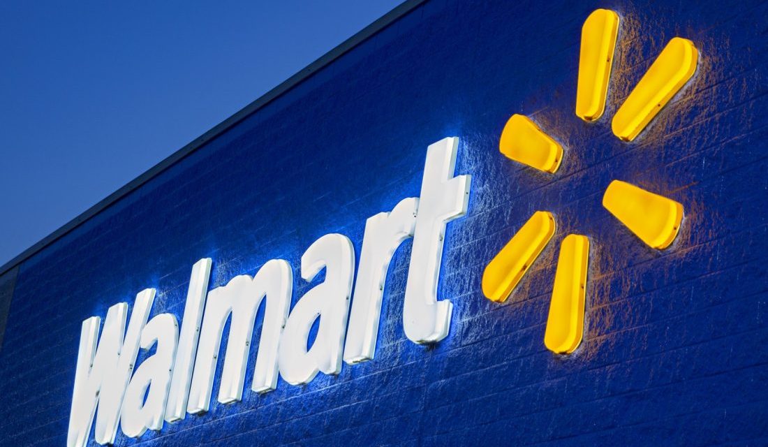 The header image shows a photograph of a lit up Walmart sign.