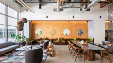 The featured image shows a co-working space.