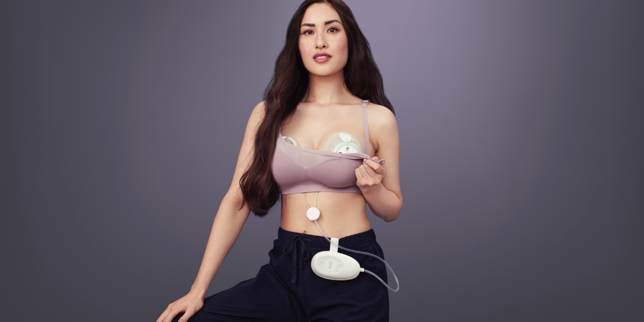 Photograph of a woman using an Elvie breast pump.