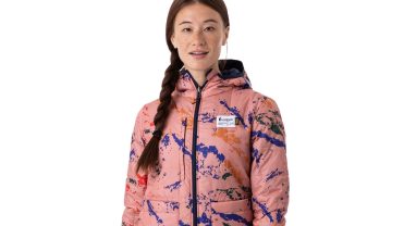 Female model with braided hair in pink Cotopaxi jacket