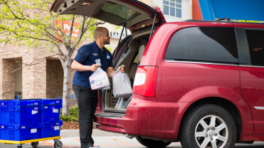 Walmart employee fulfilling curbside pickup orders