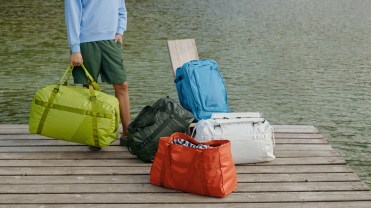 Yellow, red, blue, white and green duffel bags and backpacks from Away