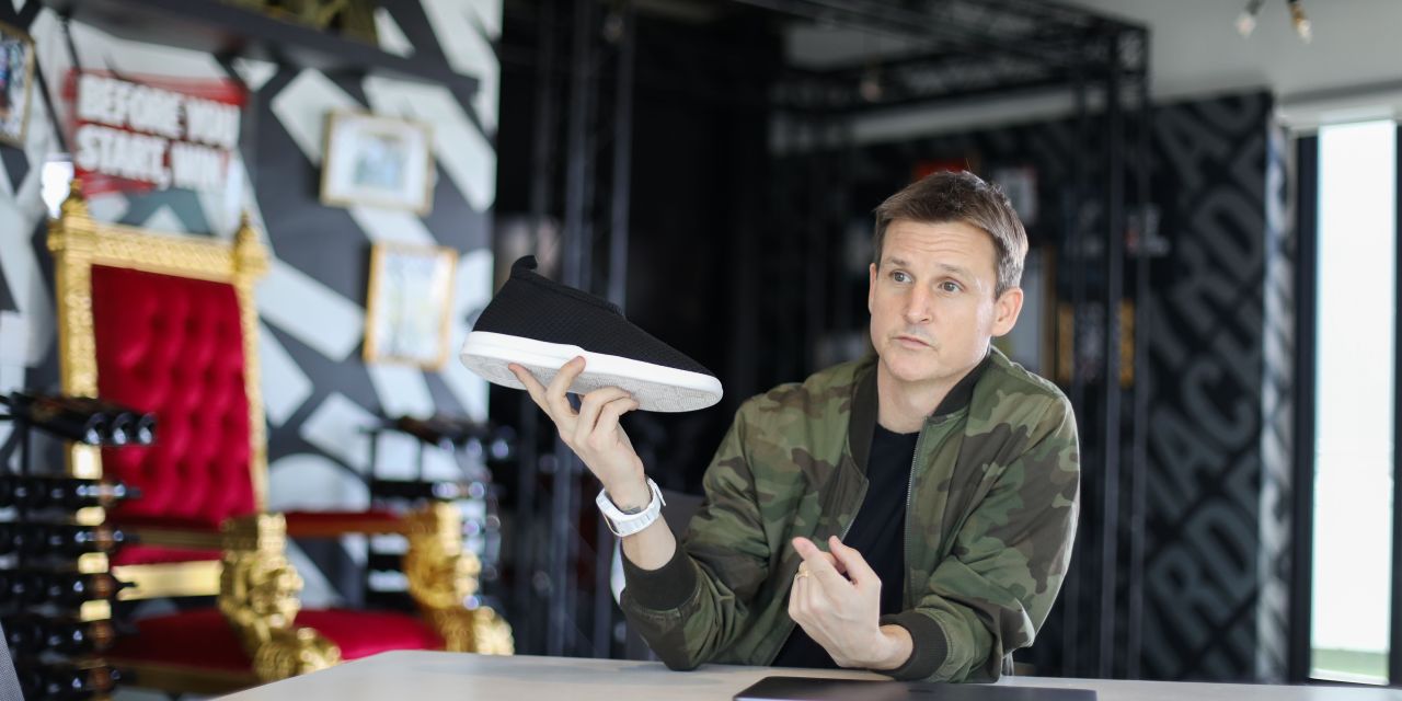 Rob Dyrdek, holding a shoe