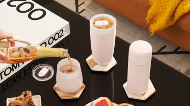 a trio of reusable tumblers on a table
