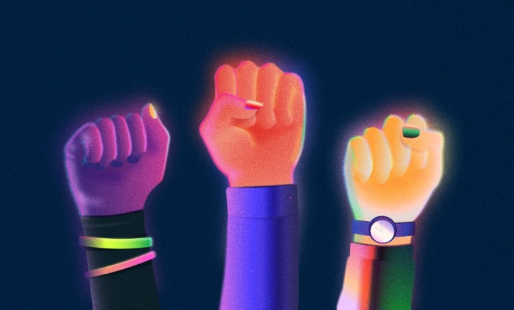 Three fists raised in solidarity with brightly colored nails on a dark navy blue background