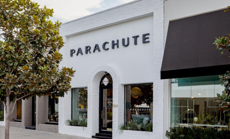 Storefront painted white with "Parachute" in black lettering