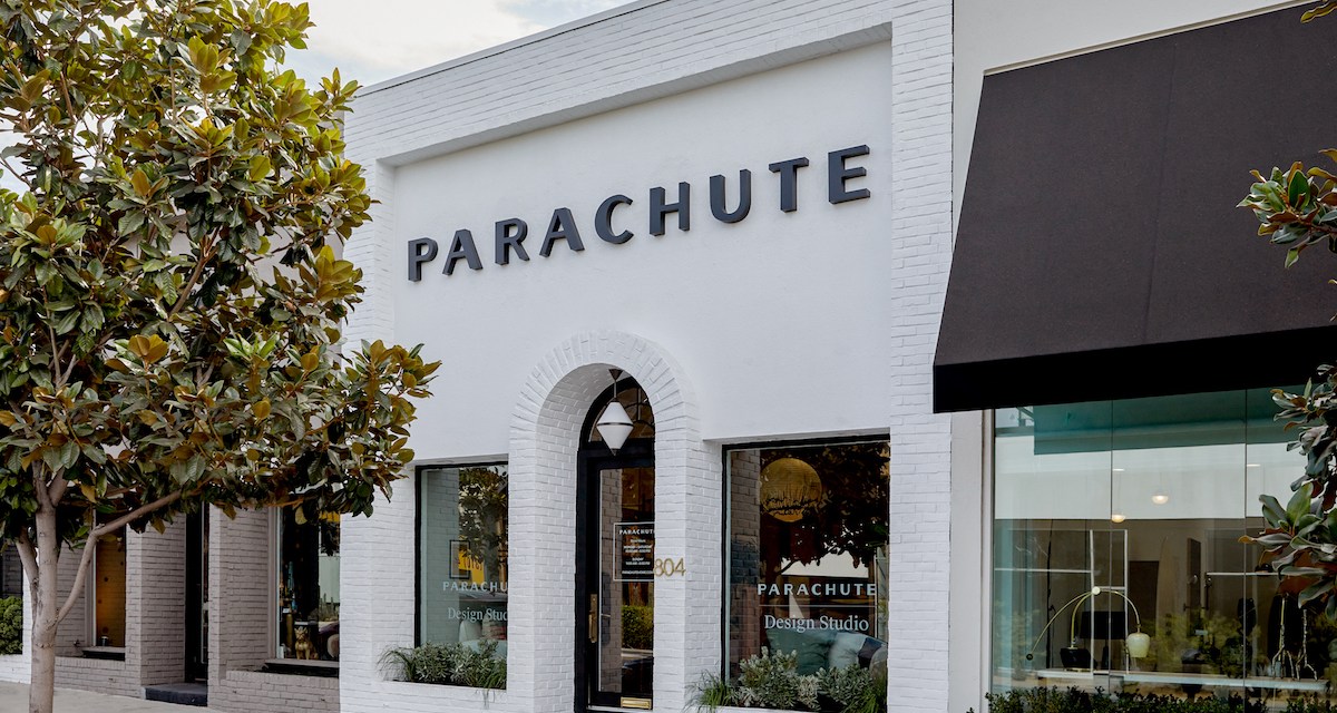Storefront painted white with "Parachute" in black lettering