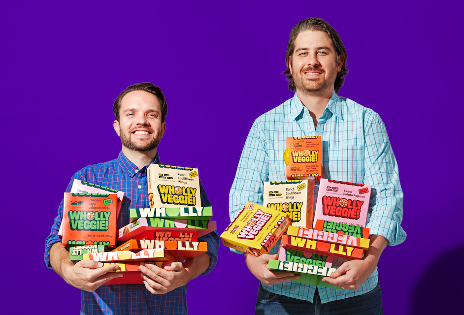 Wholly Veggie executives holding their products.