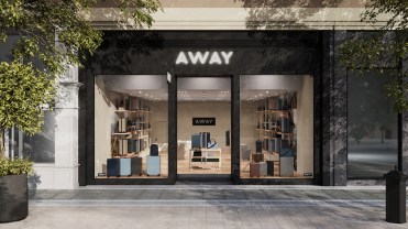 Away-branded storefront with luggage on display