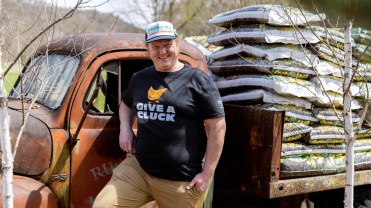 A farmer wearing Organic Valley's merchandise.