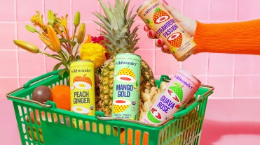 Wildwonder's products in a shopping basket with fruits.