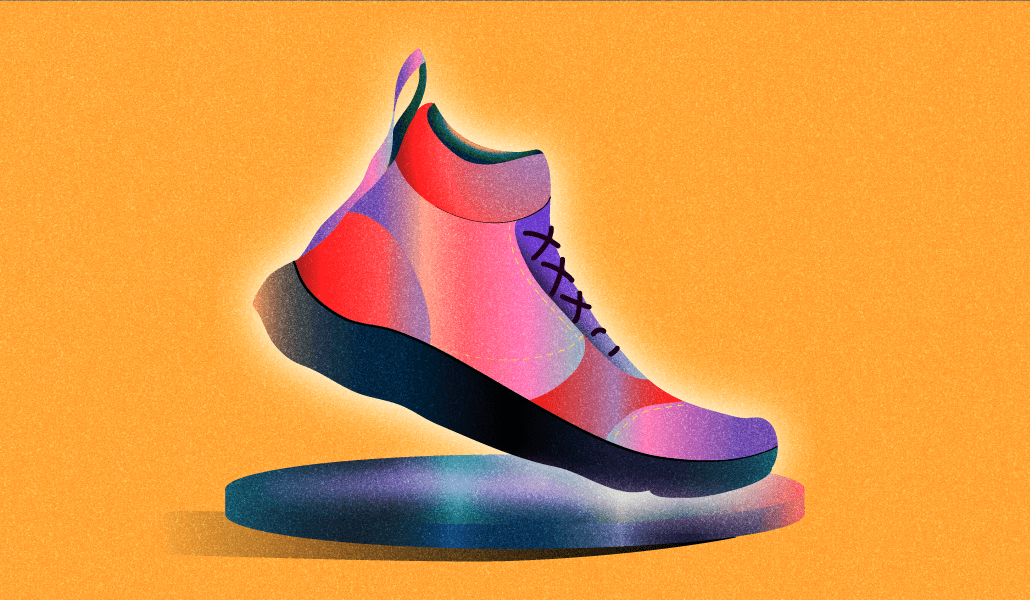 Red and black sneaker on a black hightop on an orange background