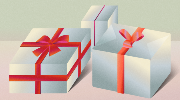 Holiday gifts, wrapped in white paper with a red bow