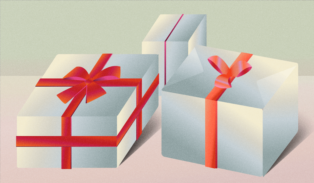 Holiday gifts, wrapped in white paper with a red bow