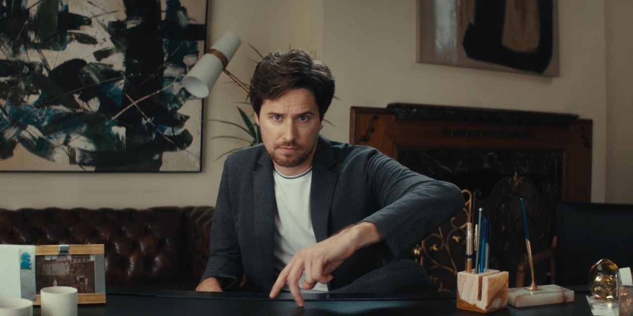 Still from Mack Weldon campaign "Comfortable Anywhere" featuring man in sweater and t-shirt