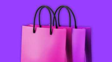 Purple shopping bags on purple background