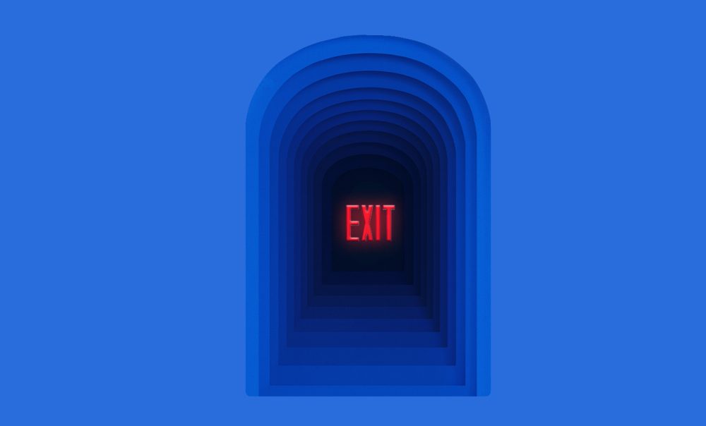 Dark archway with the word 'Exit' written in all caps in the middle.