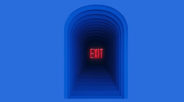 Dark archway with the word 'Exit' written in all caps in the middle.