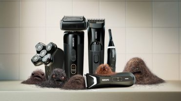 In a still from Manscaped's Super Bowl ad, electric shaving tools sit on a counter next to anthropomorphized clumps of hair