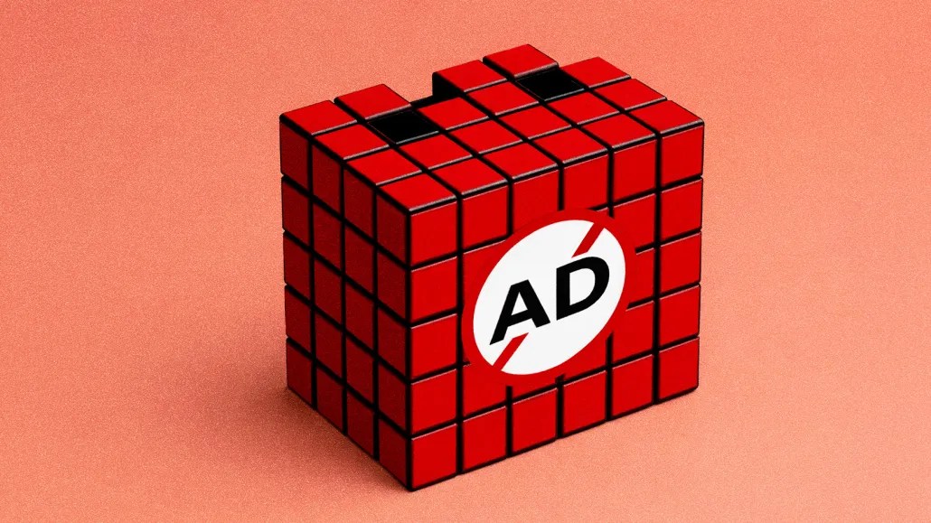 Red rubix cube with the word "ad" written on it sitting on a red background