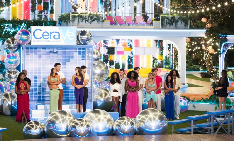 Love Island contestants stand in front of a "CeraVe" display with disco balls on the floor.