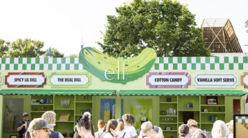 Visitors stop by E.l.f.'s dill-pickle themed booth at the Minnesota State Fair