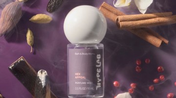 Bath & Body Works' new Hex Appeal scent on a purple background, surrounded by flowers and incense.