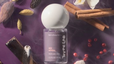 Bath & Body Works' new Hex Appeal scent on a purple background, surrounded by flowers and incense.