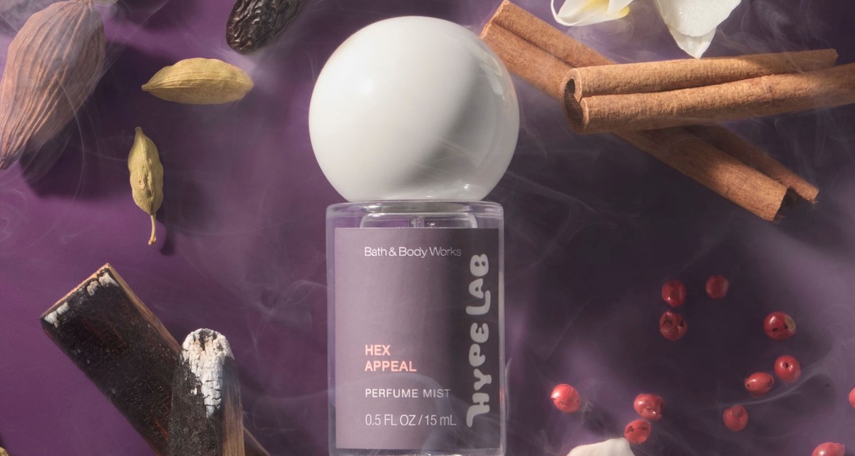 Bath & Body Works' new Hex Appeal scent on a purple background, surrounded by flowers and incense.